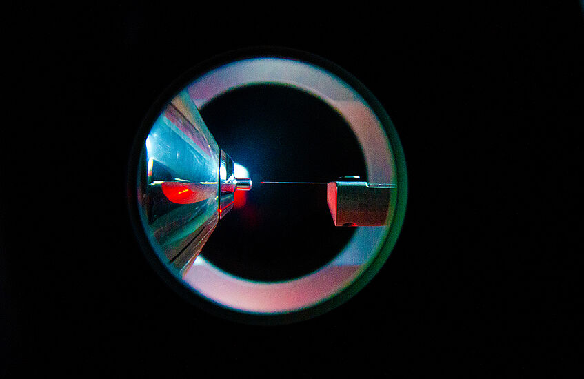This photo depicts a view into the electrospray ion source of a mass spectrometer. Mass spectrometry enables the qualitative and quantitative analysis of thousands of different molecules, allowing us to take a closer look into this world of molecules maki